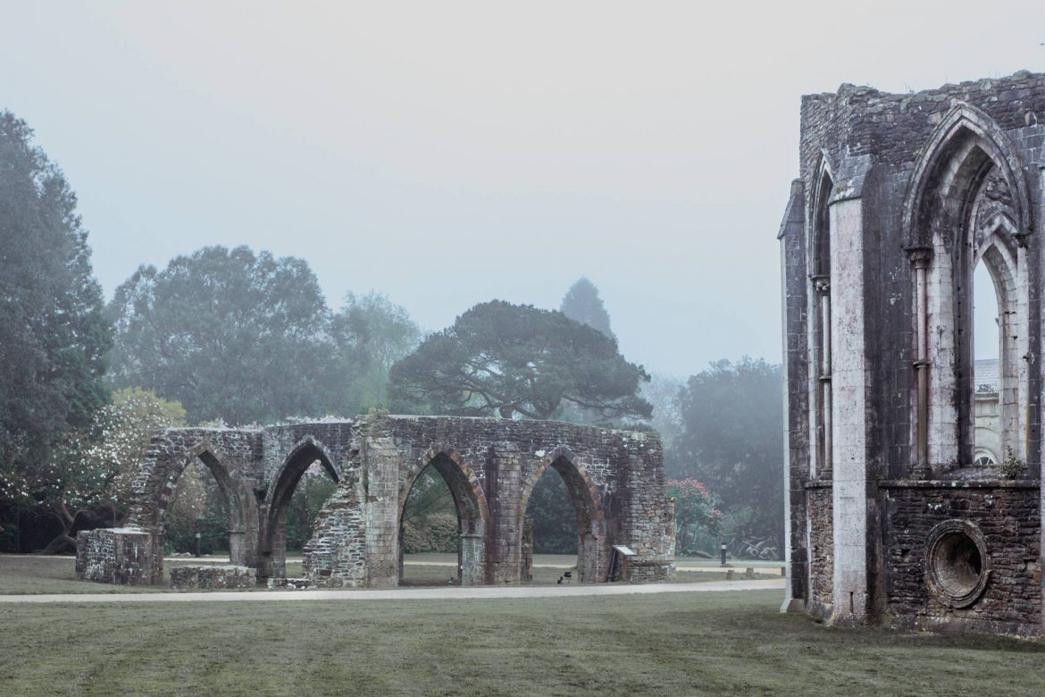 The ruins of chapter house, part of Margam Abbey at Margam Country Park, Port Talbot on a misty morning.
